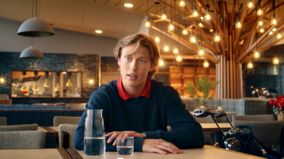 guy sat at a table in restaurant