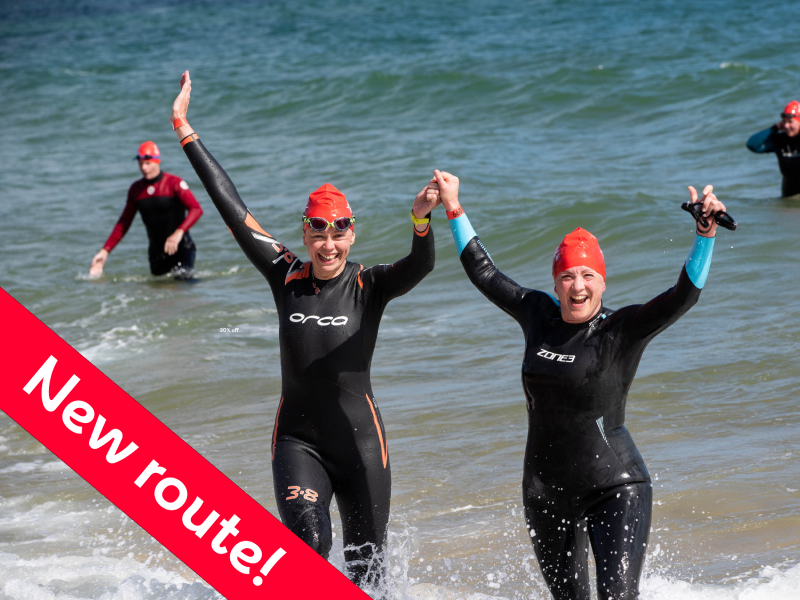 Swimmers celebrating on the beach