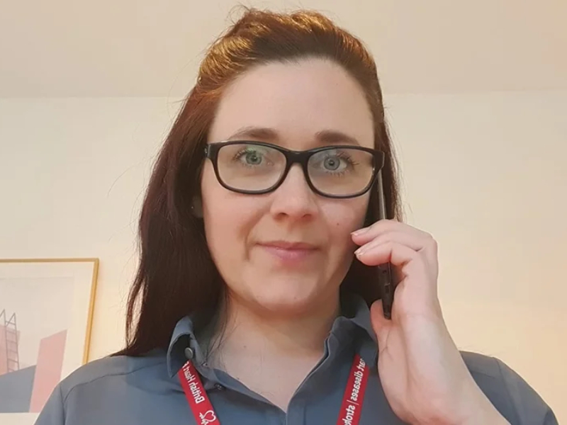 A nurse on the phone to a patient