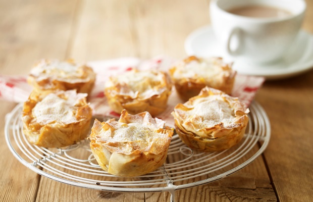 Mince pies sitting on a cooling tray 