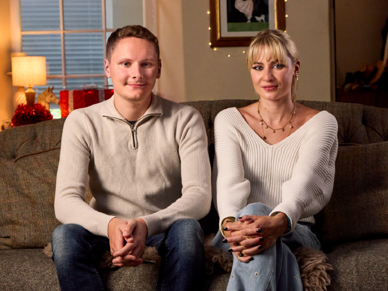 Macy and Monty sat on a sofa