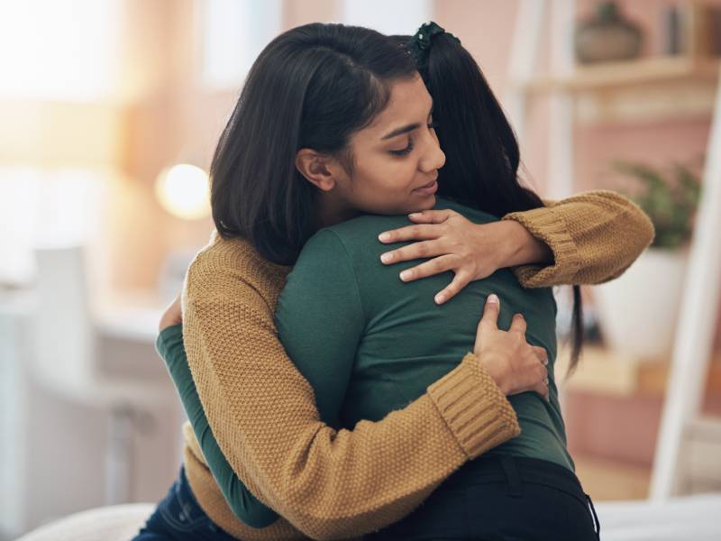 Two women hugging
