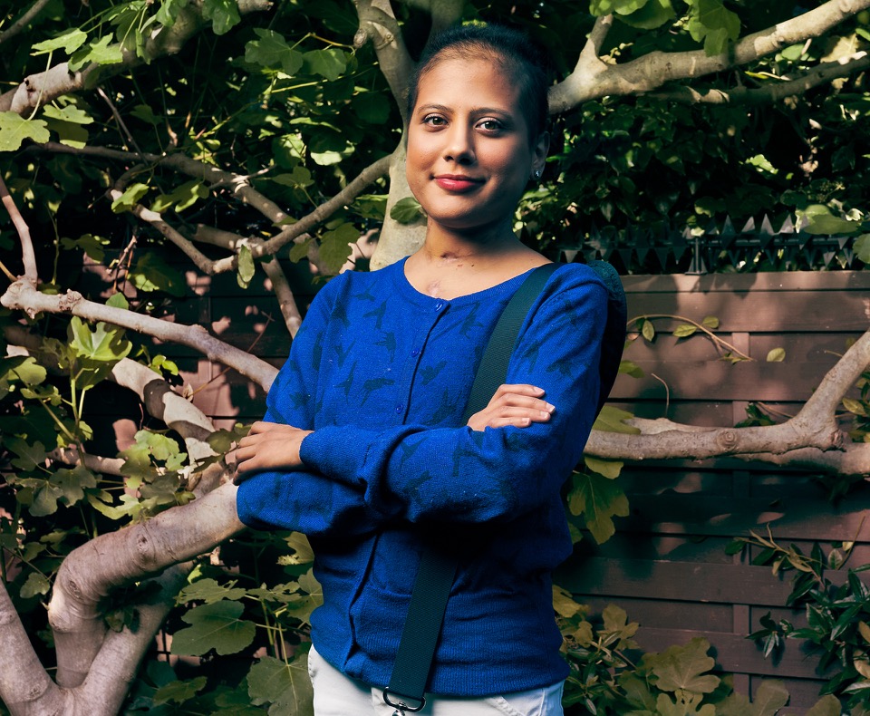 Thalyta stood with her arms crossed in her garden