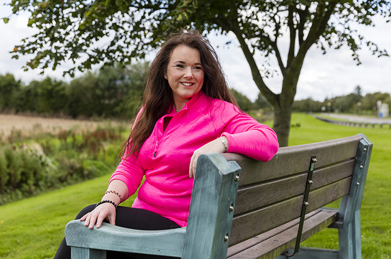 Jen Stevens sitting on a bench