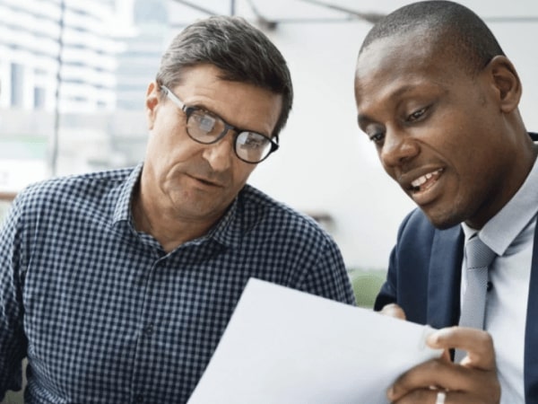 A person discusses their will with a solicitor