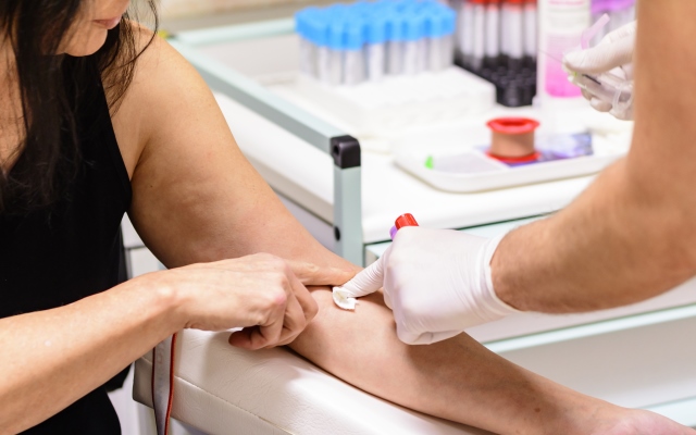 Woman having blood taken