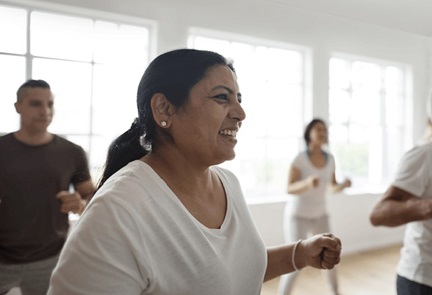 Asian woman in a group exercise class