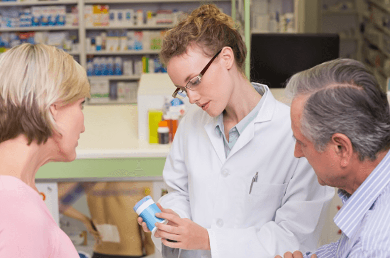 Pharmacist speaking to patient about their medication