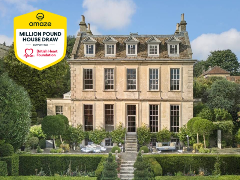 A photograph of a house in Bath next to the Omaze logo.