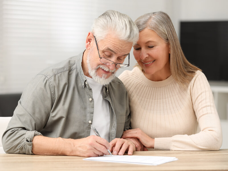 A man and a woman are writing a Will together
