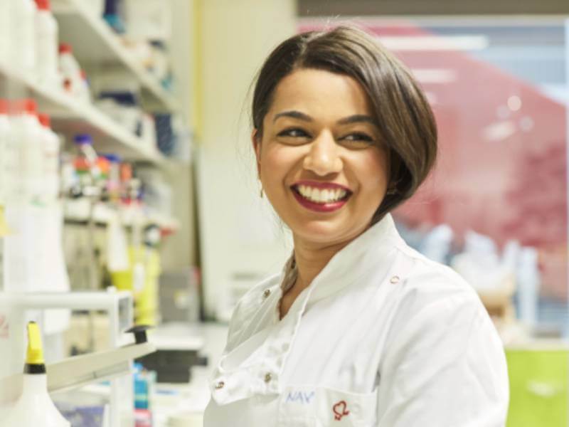 Young researcher smiling in a laboratory