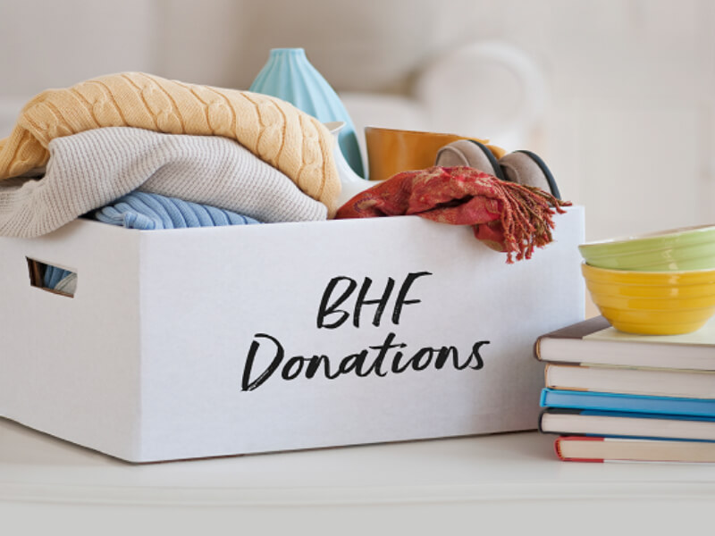 A box filled with various household items to donate.