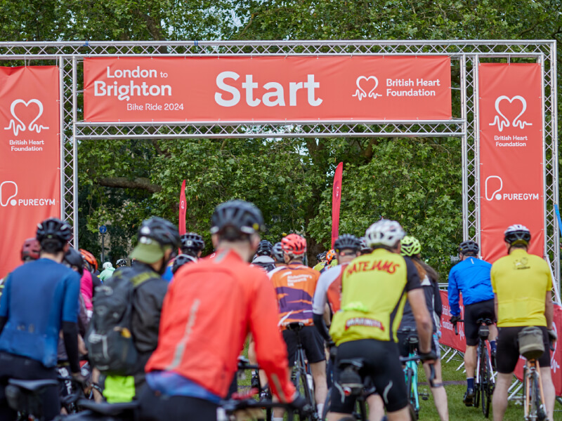 A group of riders at the starting line of a bike ride