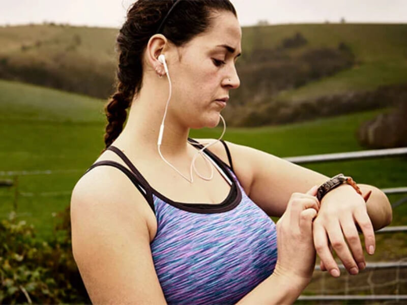 A runner looking at their watch