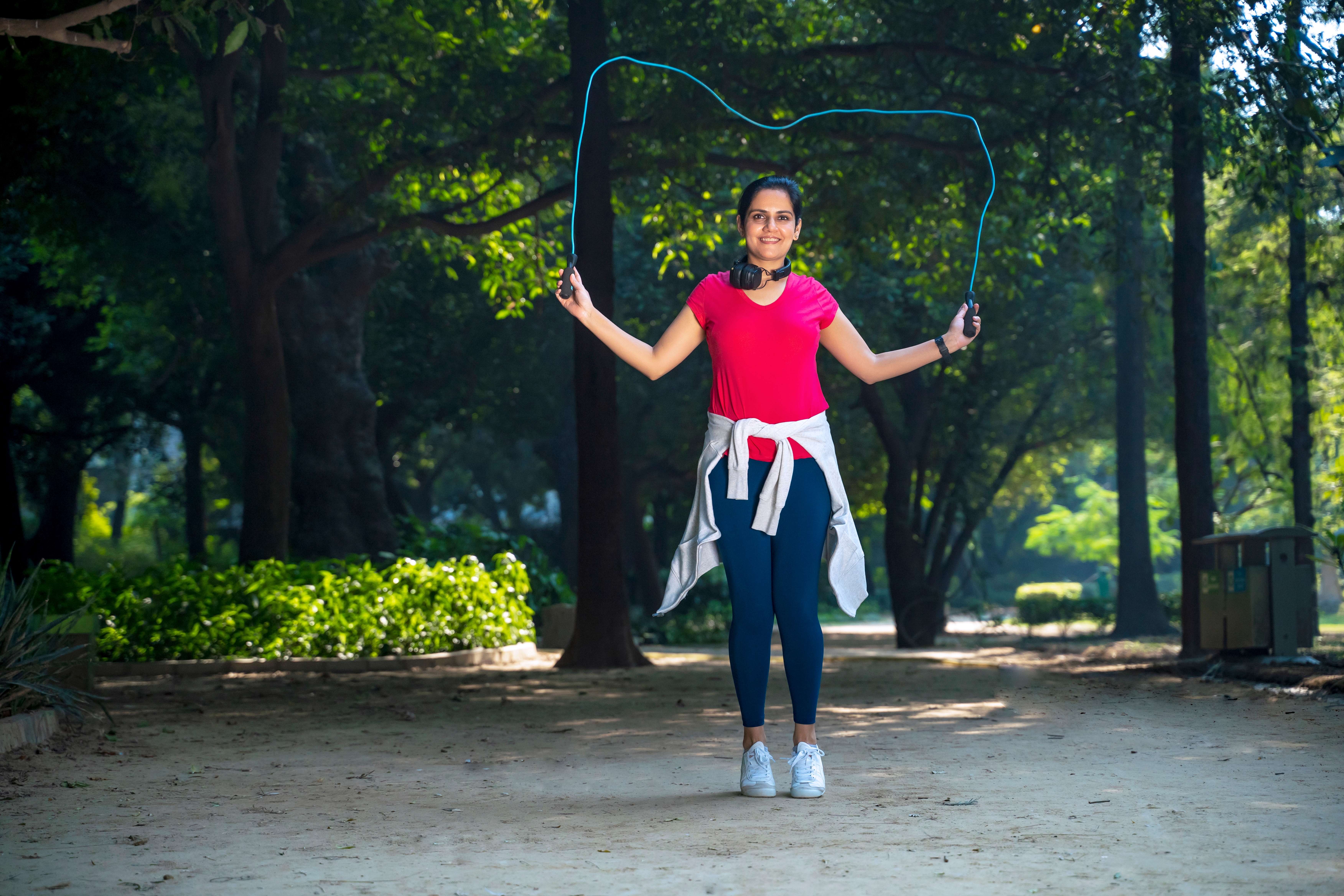 Person skipping with rope outdoors