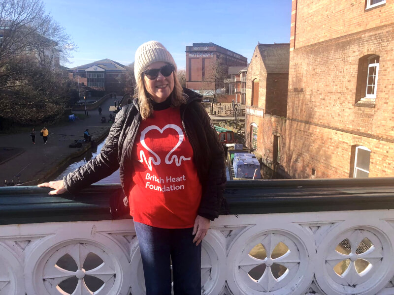 A photograph of Ruth, standing on a bridge.