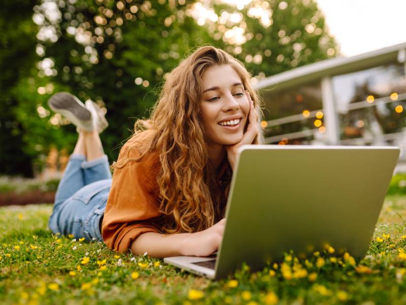 A person works on their fundraising page on a laptop
