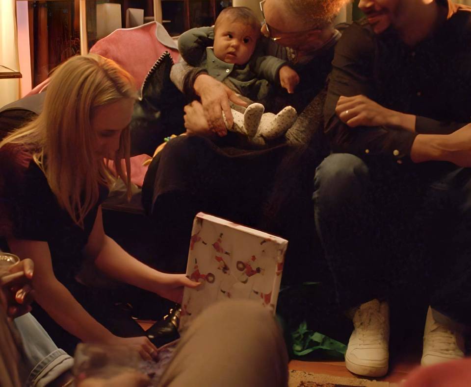 Family opening Christmas presents