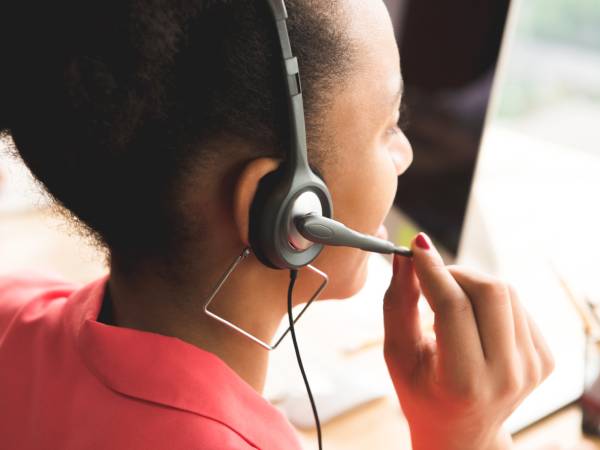 Heart helpline volunteer with headset on
