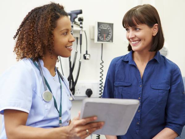 Healthcare worker talking to patient