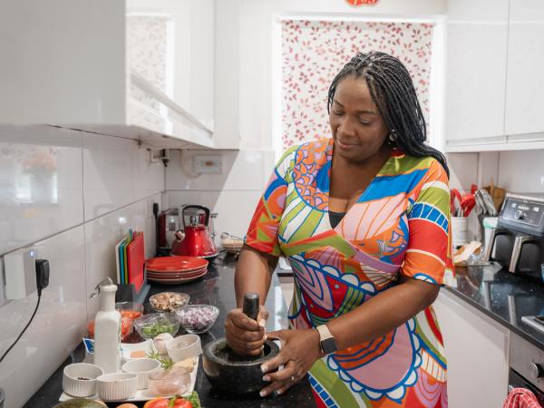 Person cooking healthy food in home kitchen