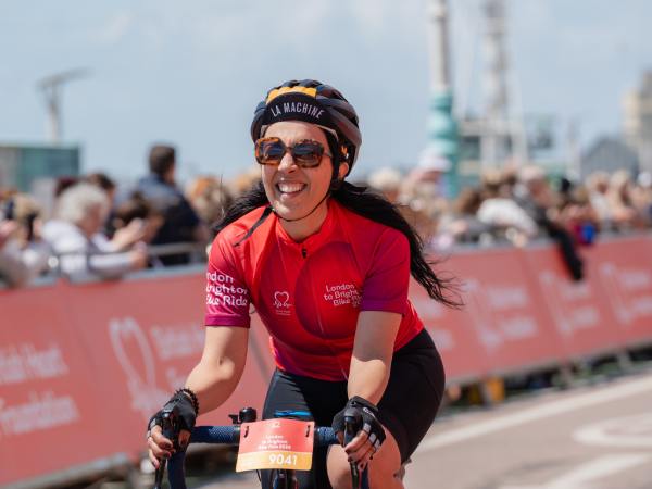 cyclist on bike, wearing bhf jersey