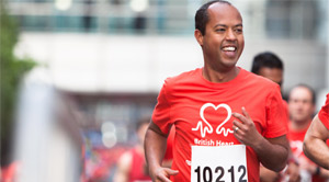 A man running and smiling