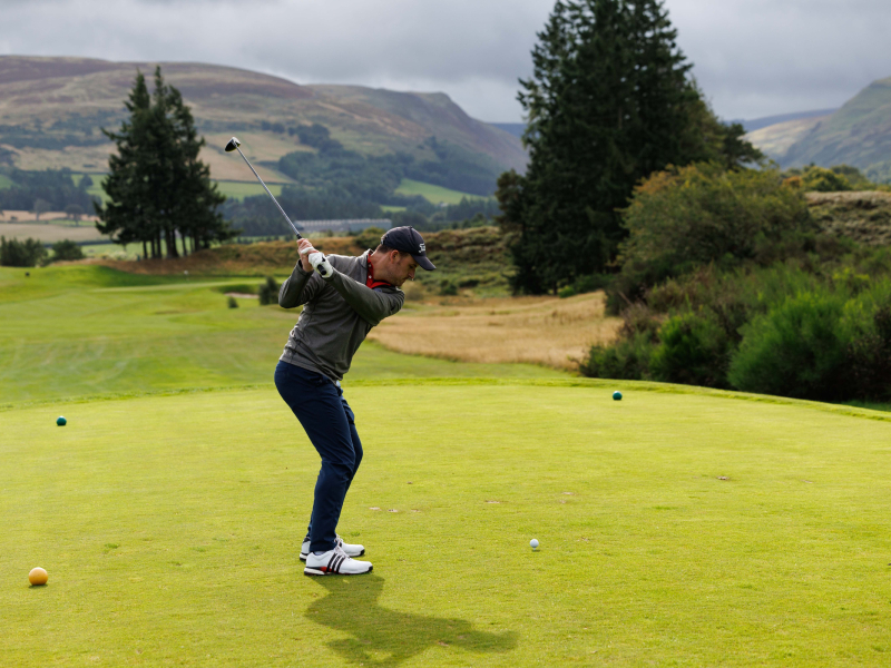 Andrew Chapman teeing off at a golf course