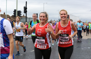 Two BHF runners smiling.