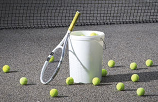 tennis racquet and balls