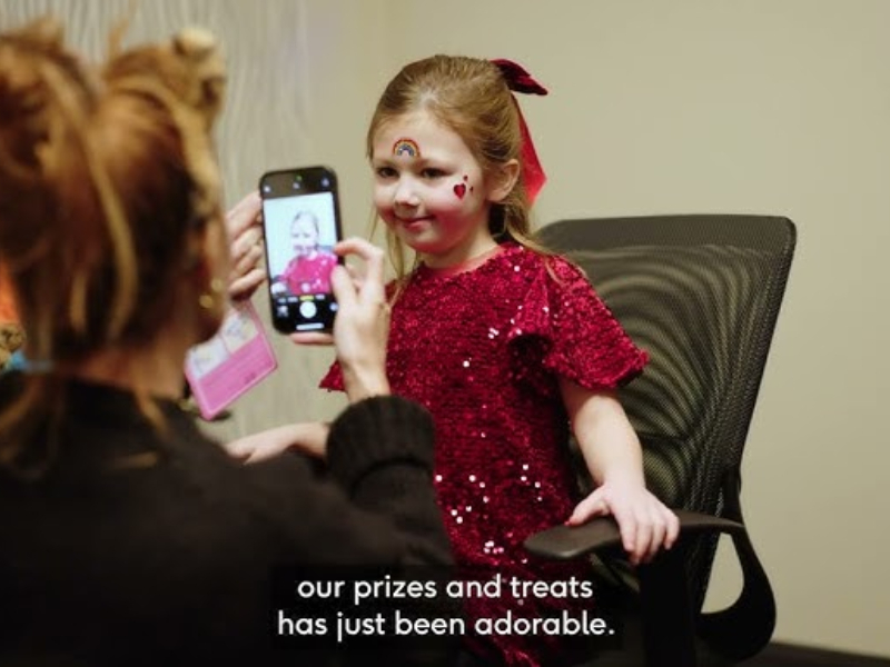 A child getting their picture taken