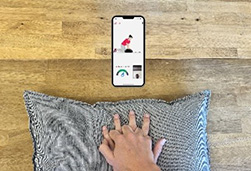 Birds eye view of someone demonstrating CPR on a pillow