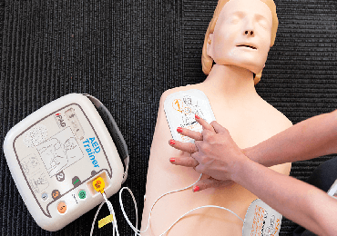 a cpr dummy and a defibrillator