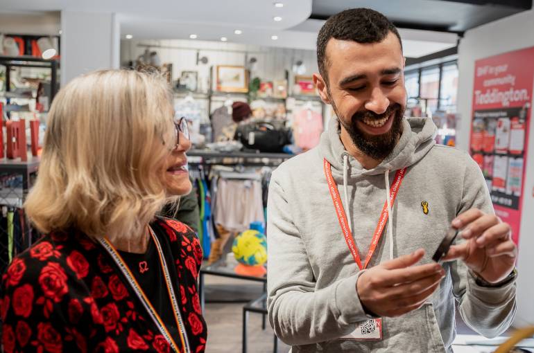 A volunteer works in a BHF shop