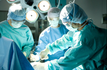 Surgeons performing an organ transplant