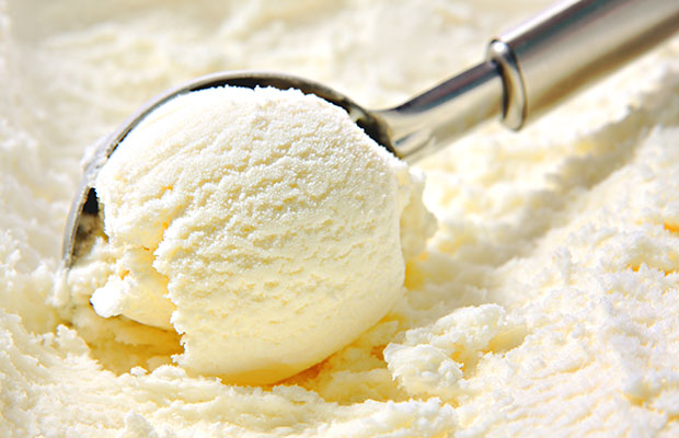 Vanilla ice cream being scooped up
