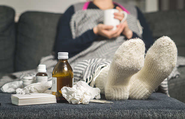 Person with a cold on the sofa