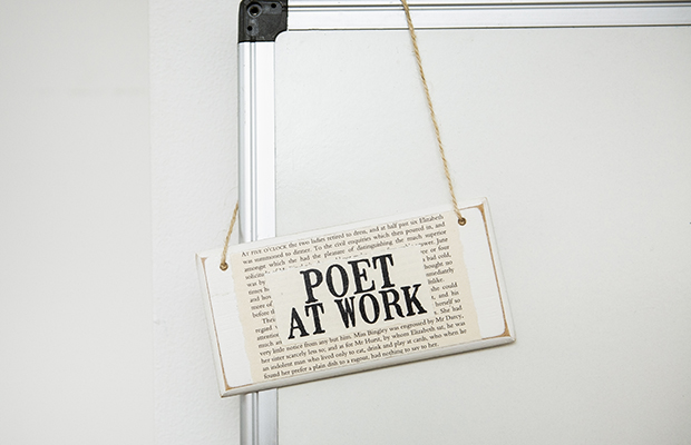 Poet at work sign
