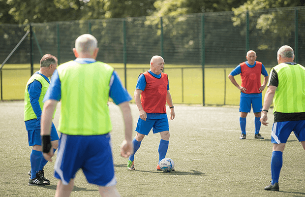 Group of men playing walking football