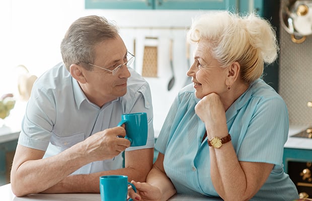 Older couple having a chat in the kitchen