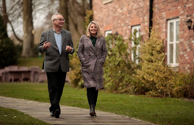 Alan Atack and Natalie Duffin walking along a path
