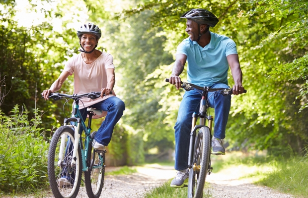 couple cycling in countryside