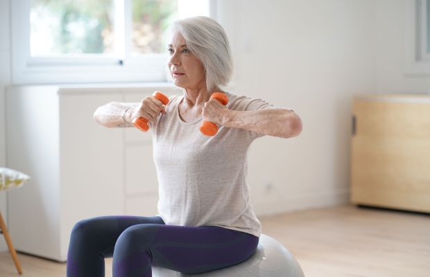 mature woman exercising at home