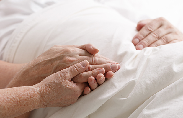 Woman holding a man's hand 