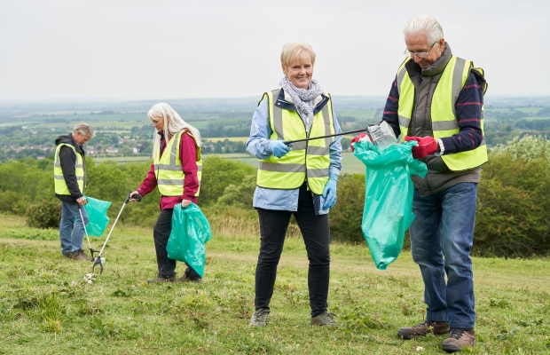 seniors picking litter in the country