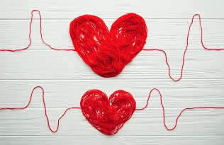 Two red hearts made of string