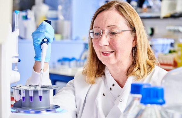 Female researcher using research equipment in a lab