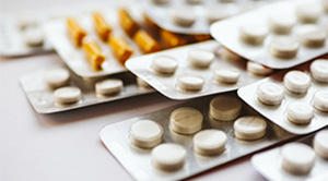 Packets of medicine on a table.