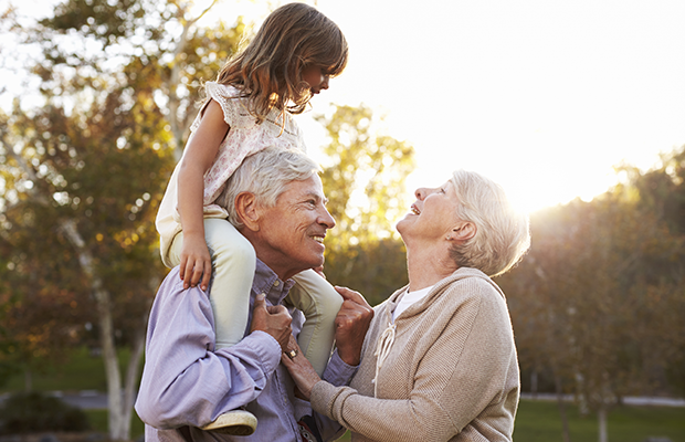 Senior couple with grandchild in park