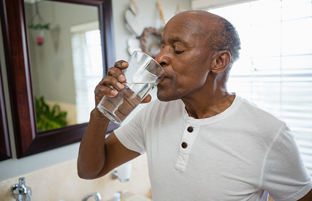 Man drinking glass of water